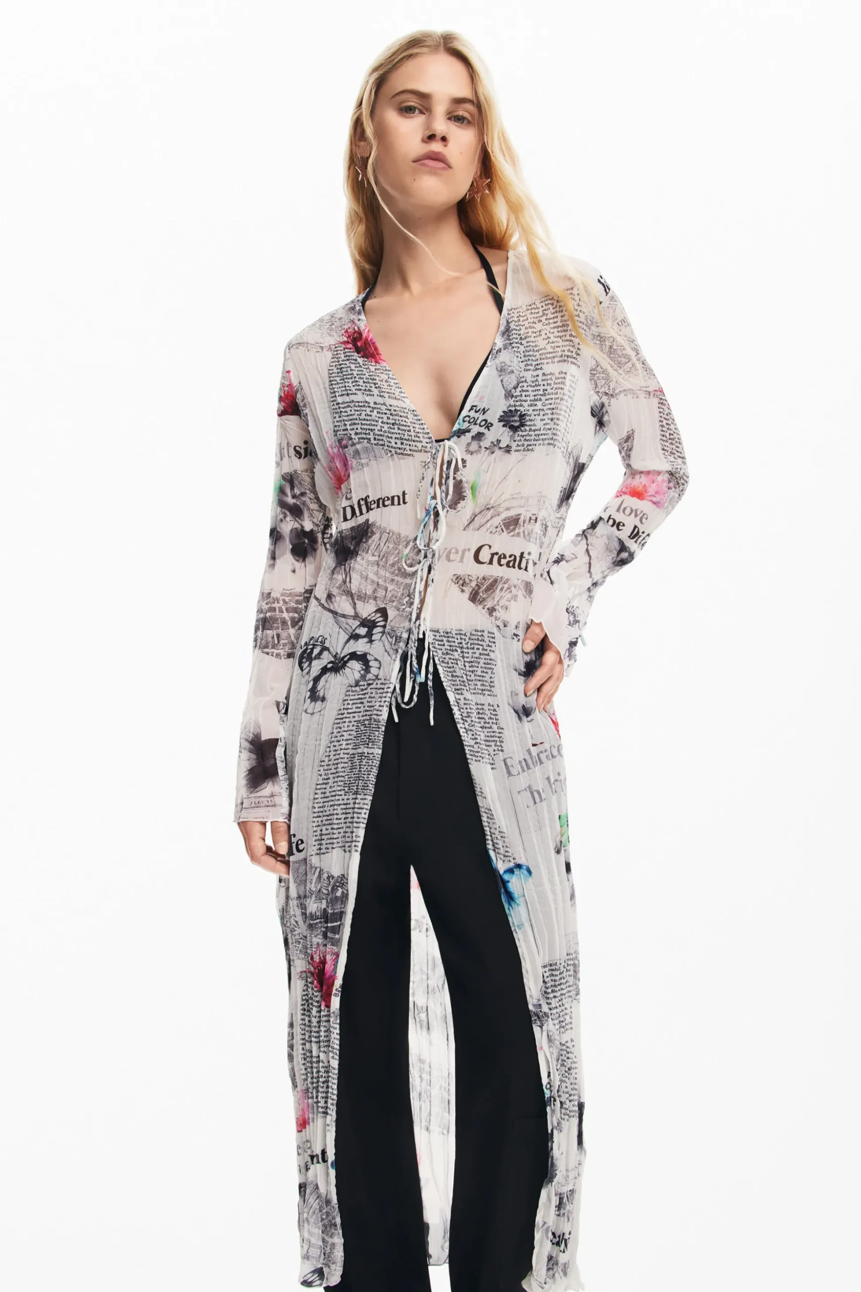Blusa larga estampado periódico