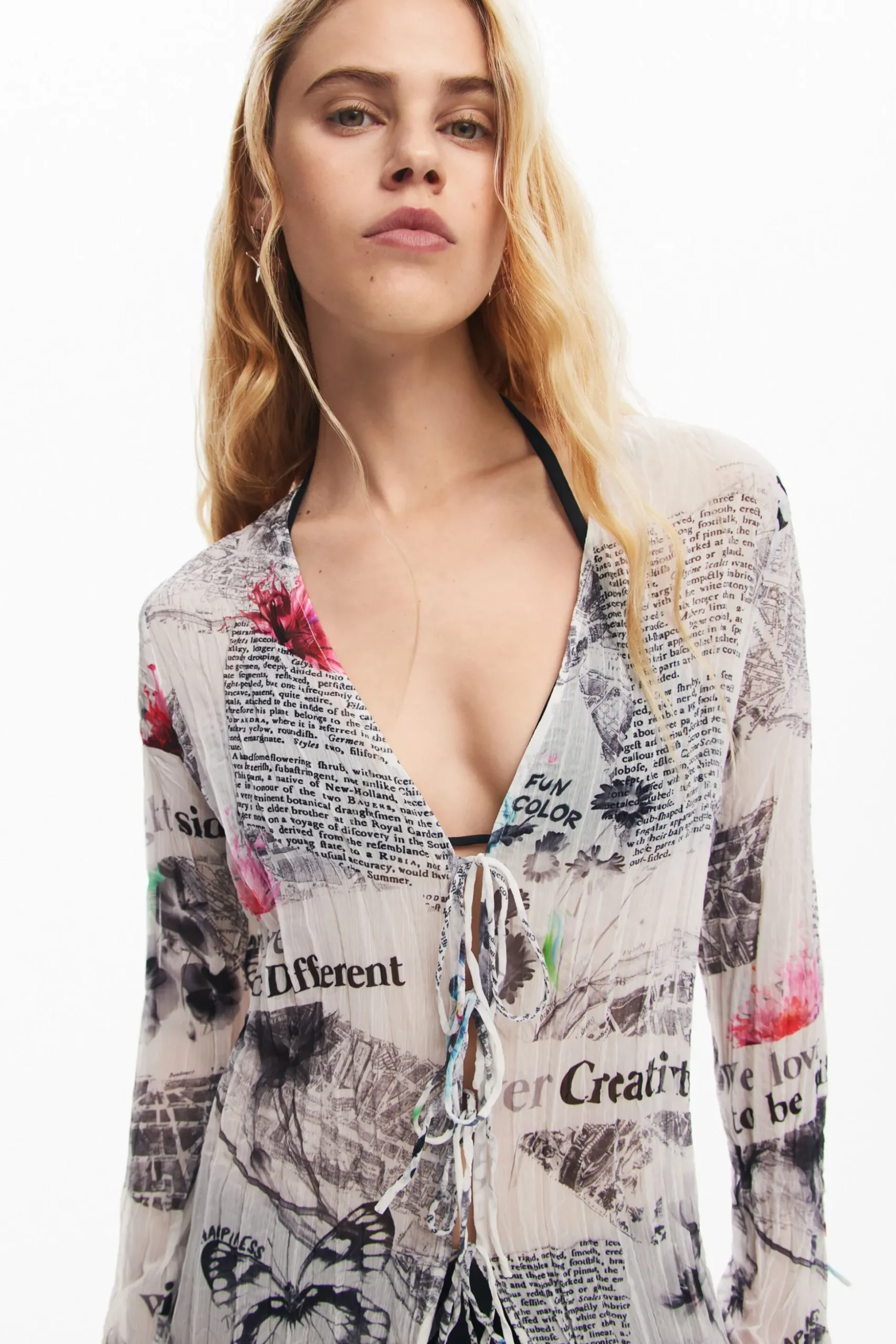 Blusa larga estampado periódico