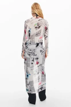 Blusa larga estampado periódico