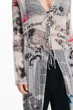 Blusa larga estampado periódico